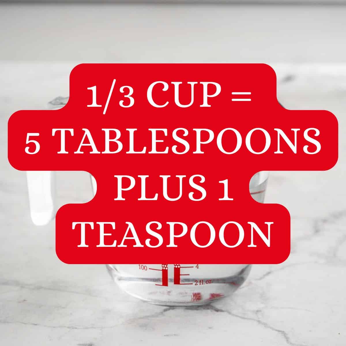 ⅓ cup glass of water with text overlay: ⅓ cup equals 5⅓ tablespoons.