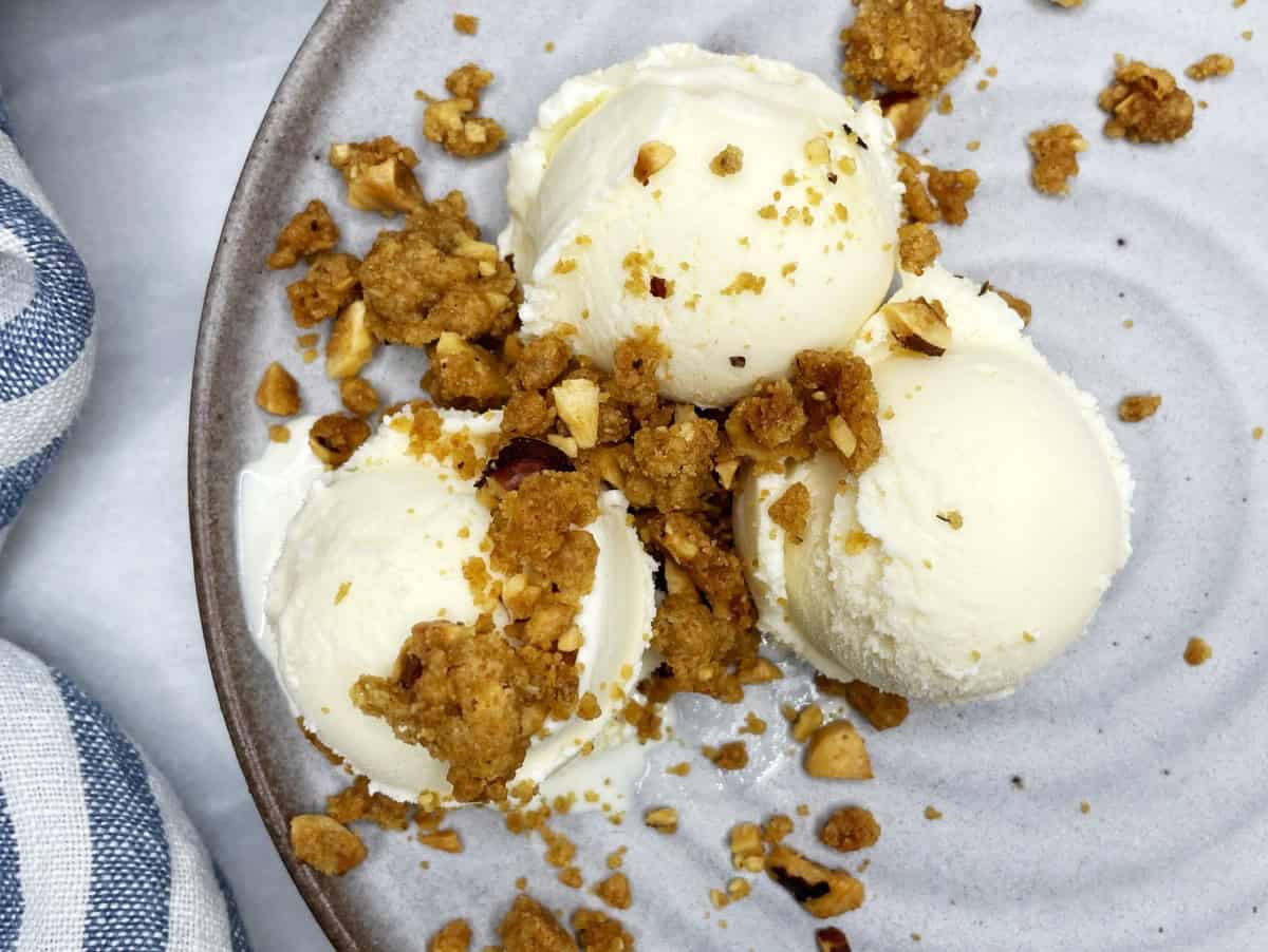 Vanilla ice cream topped with streusel topping.