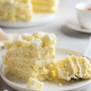A single slice of Mimosa cake on a dessert plate.