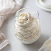 Mascarpone whipped cream piped in a glass.