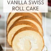 Sliced vanilla Swiss roll cake on a marble board: Pin with text.