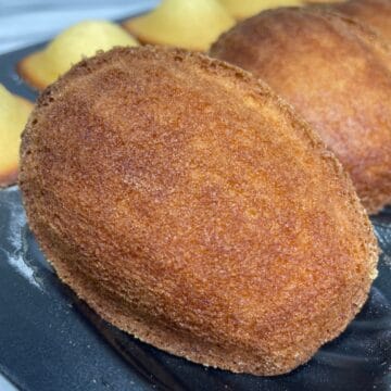 Flavored madeleines on a madeleine pan.