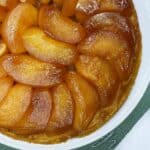 Tarte Tatin with caramelized apples packed on top of puff pastry.