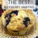 Unwrapped blueberry muffin on a marble board; other muffins in the background: Pin with text.