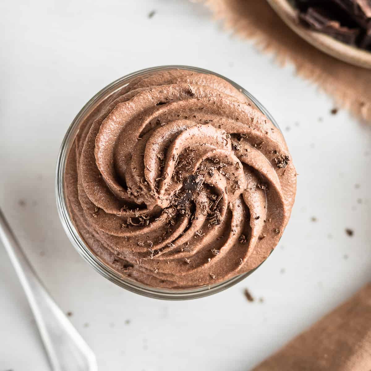 Chocolate whipped cream piped in a glass