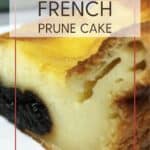 A slice of prune cake on a white plate with plates and flatware: Pin with text.