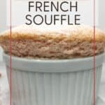 Pink-colored French souffle with crushed pink praline in the background: Pin with text.
