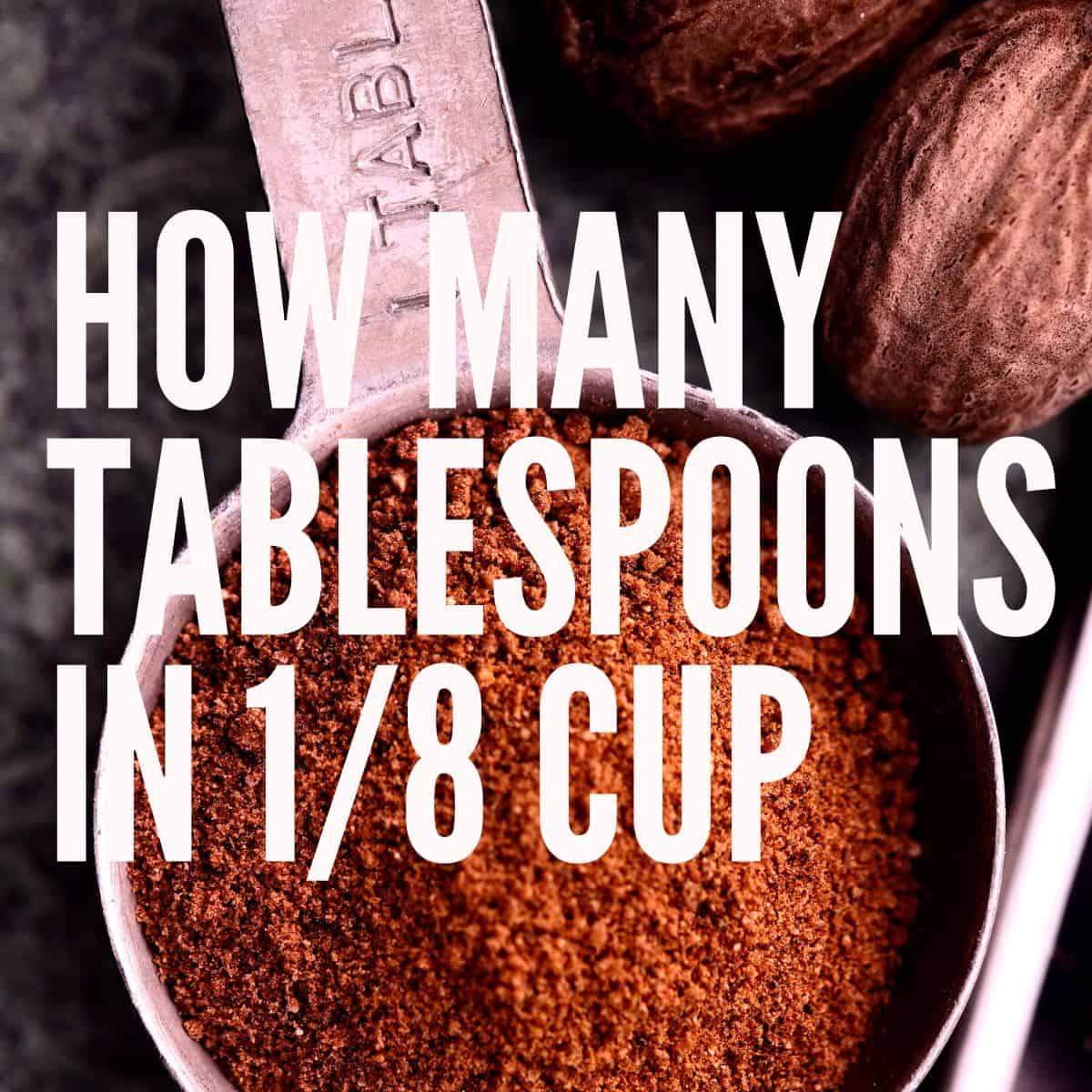 Ground nutmeg in a measuring tablespoon