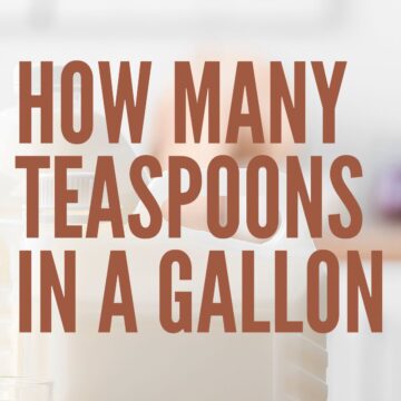 Gallon bottles of milk on a kitchen table.