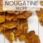 Stacked almond nougatine pieces on parchment paper: Pin with text.