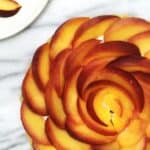 French peach tart with peaches arranges in a pretty flower design: Overhead view
