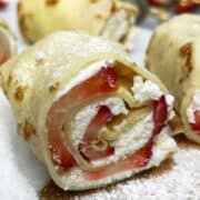 Polish crepes filled with farmer cheese and strawberries.