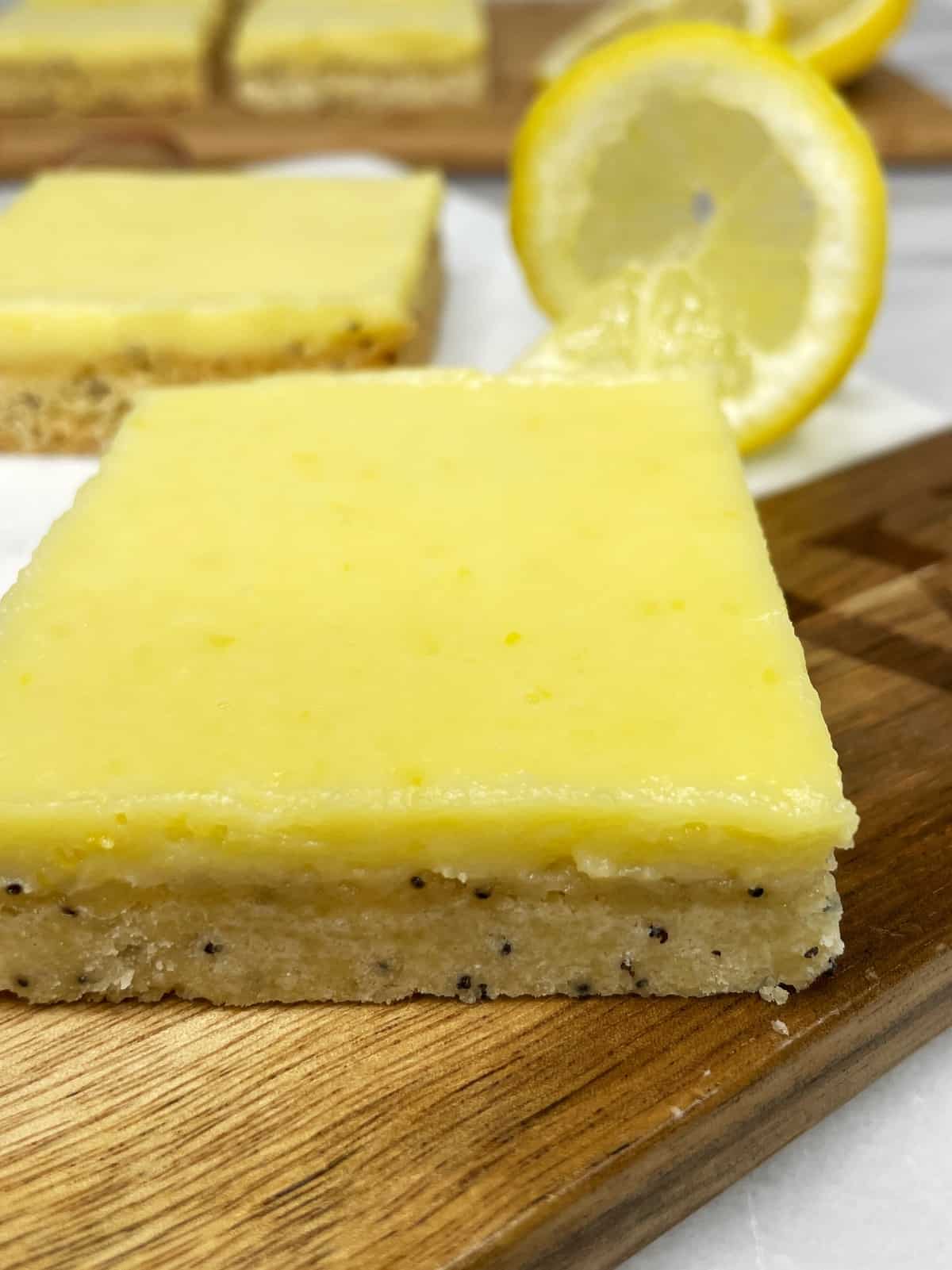 Sliced lemon squares on a wooden/marble board
