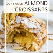 Halved baked almond croissant on a plate: Pin with text.