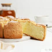 Sliced apple sponge cake on a dessert plate.