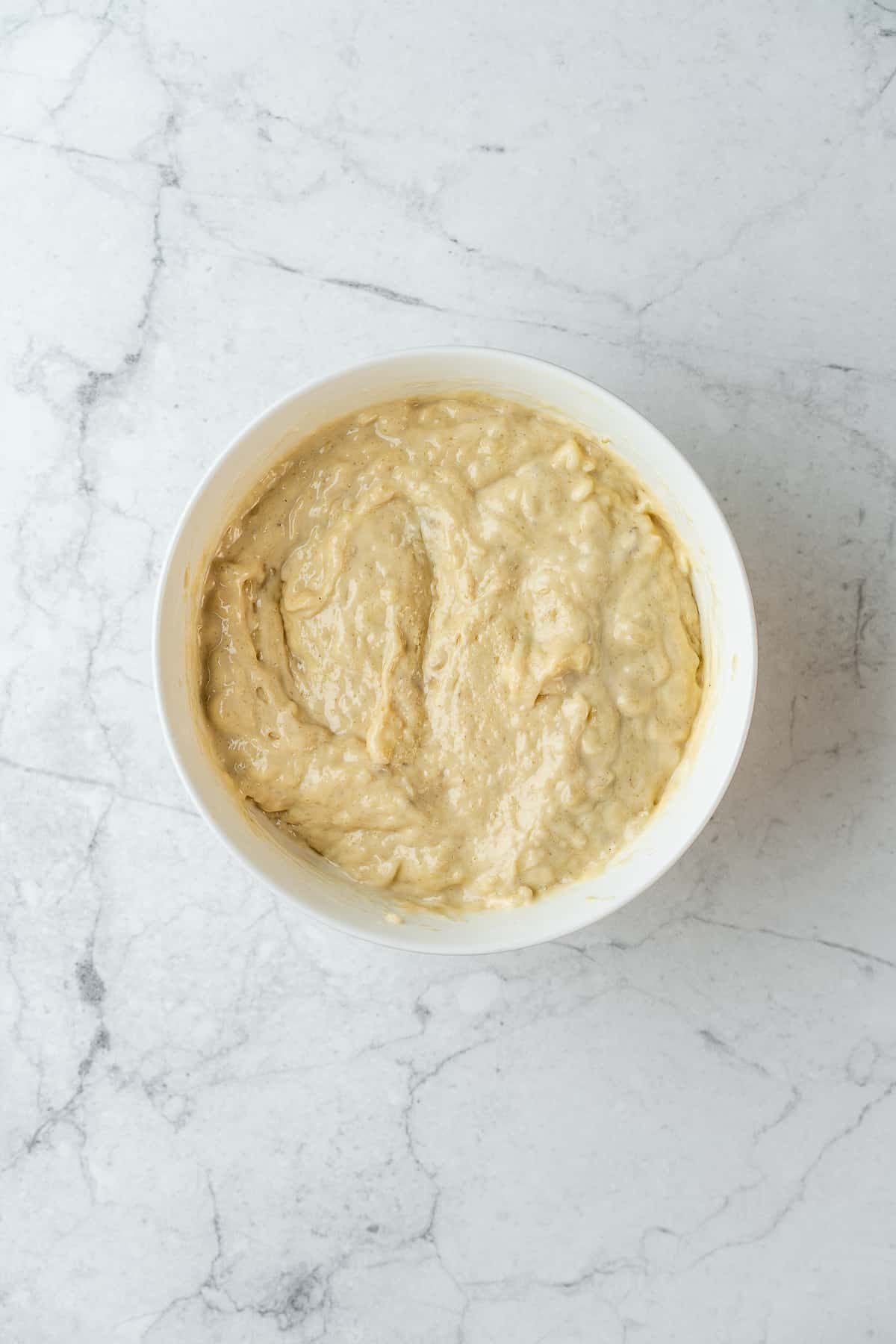 Banana bread batter in a bowl.