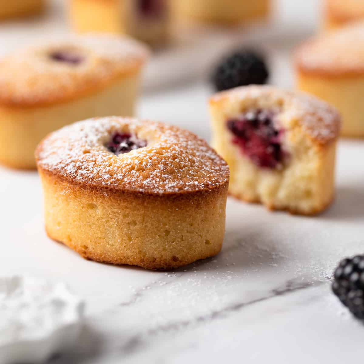 Blackberry friands on a marble board 