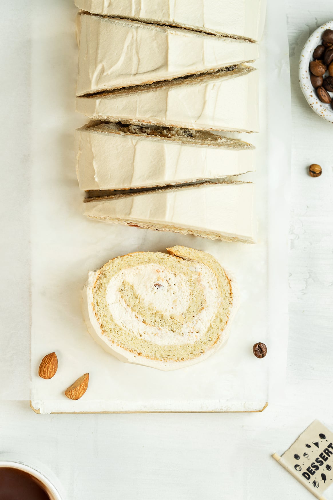 Sliced coffee cake roll on a serving board 