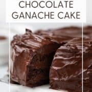 Sliced chocolate ganache cake on a white serving plate: Pin with text.