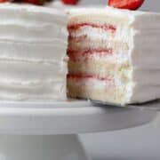 Sliced Korean fresh cream cake on a white stand.