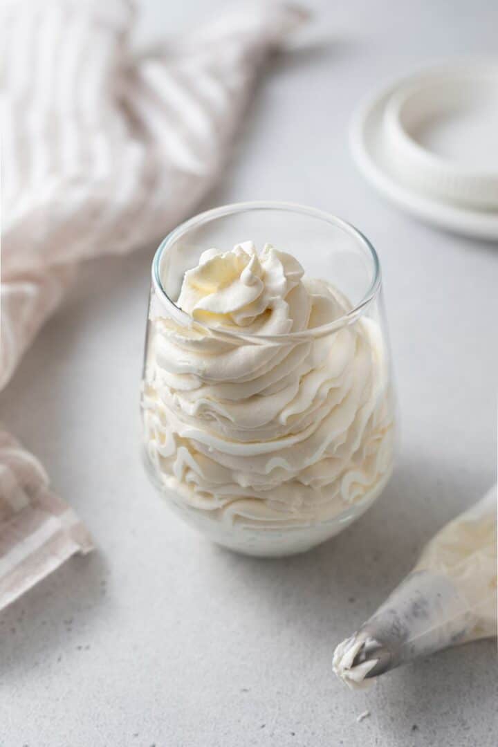 Mascarpone whipped cream piped in a glass
