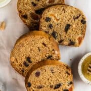 Sliced French gingerbread loaf on baking paper.
