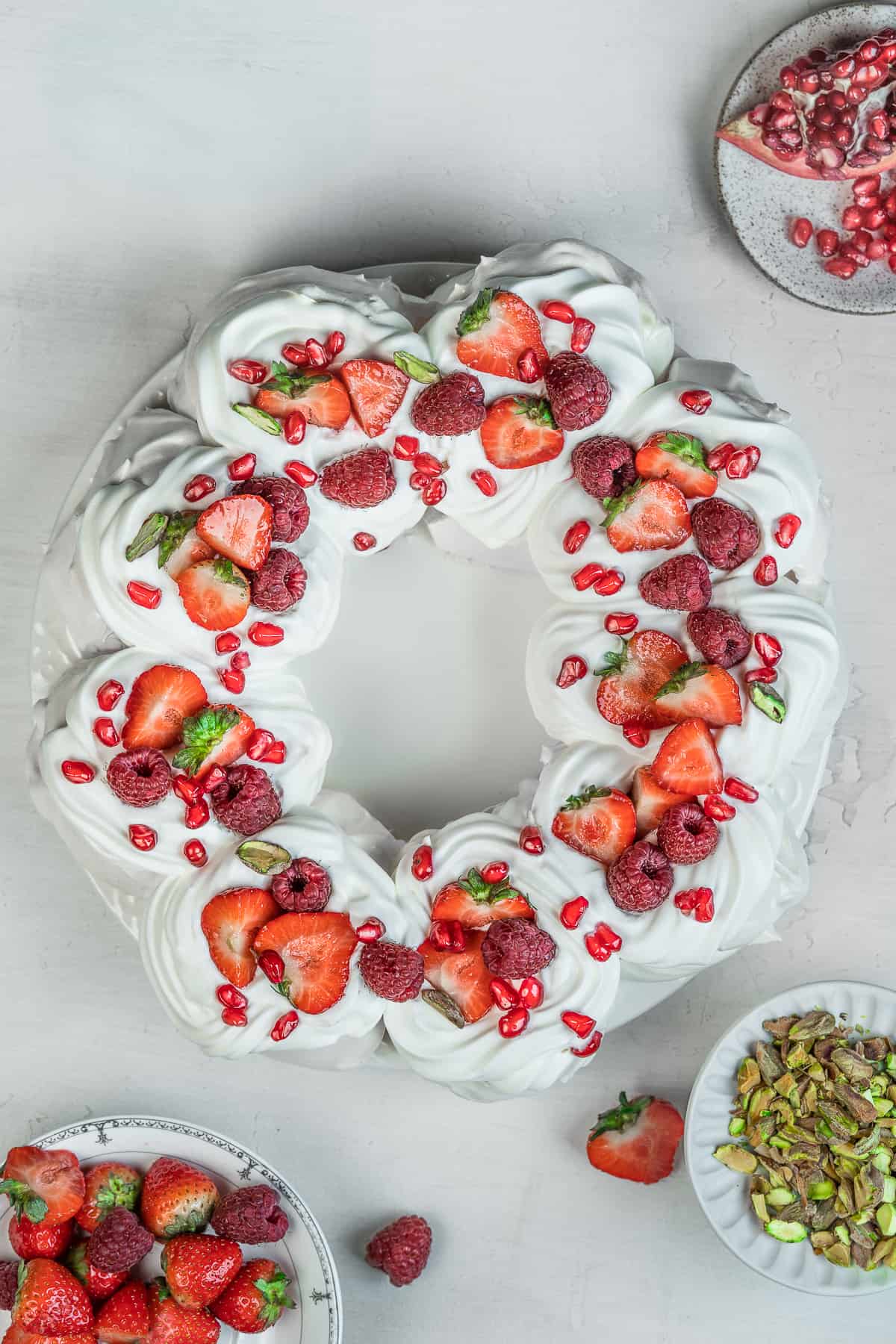 Decorated Pavlova wreath on a serving platter.