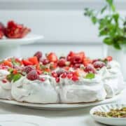 Christmas Pavlova wreath on a serving platter.