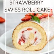 Decorated strawberry Swiss roll cake on a white serving plate: Pin with text.