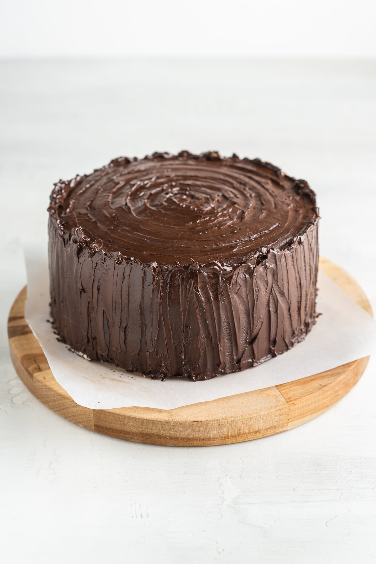 Cake covered with chocolate ganache.