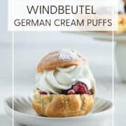 A single Windbeutel on a white dessert plate: Pin with text.